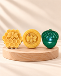 Golden Hour: Honeycomb Bee, Round Honey Bee and green Acorn soaps, from left to right.