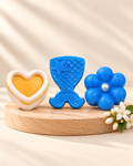 Jasmine Collection: white and gold Heart, blue Mermaid Tail and blue and silver Daisy soaps, from left to right.