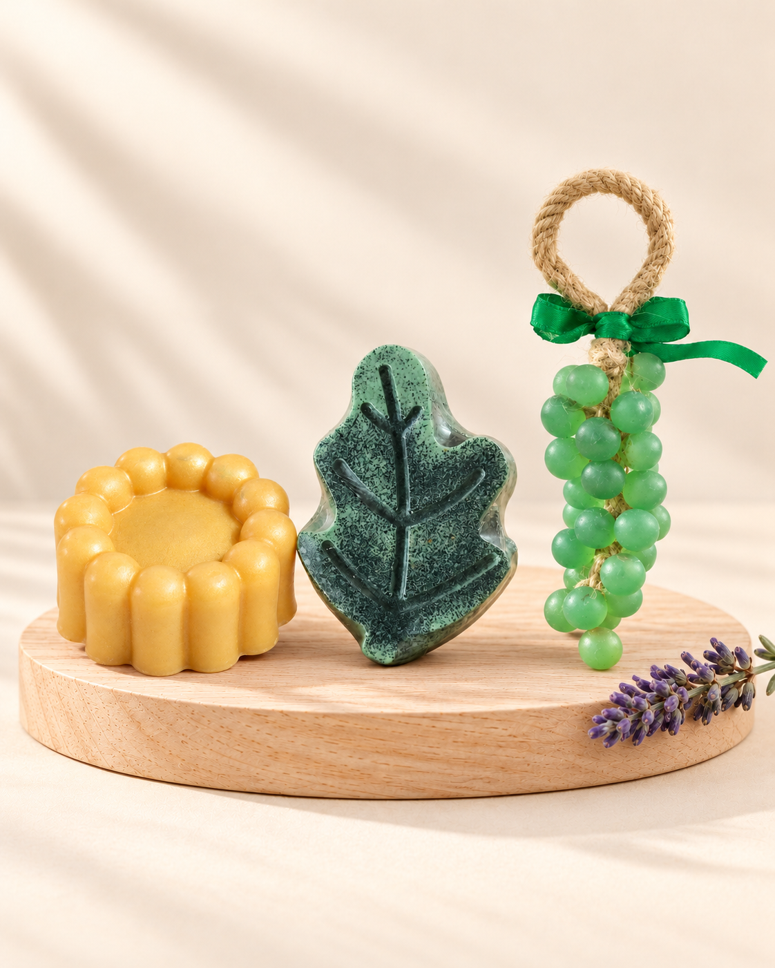 Lavender Garden: gold Rose 6, green and black Leaf and green Grape soaps, from left to right.